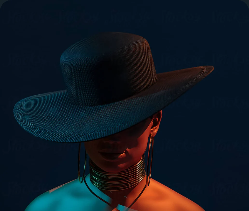 A high-fashion portrait of a model in a wide-brimmed hat under coloured light
