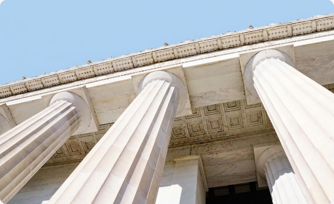 Regulatory compliance — classical columns representing structured governance and reporting